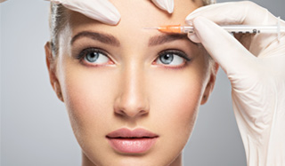 Beautiful woman receiving a medical cosmetic injection of Botox.